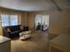 Inviting living room features a comfortable black sofa and white oval coffee table at 5536 Denmark Dr, Bradenton, FL 34207