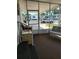 View of the enclosed porch, offers additional living space and access to the outdoors with comfortable seating at 5536 Denmark Dr, Bradenton, FL 34207