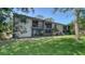 Condo backyard featuring enclosed balconies and sliding glass doors, perfect for relaxing at 5649 Summerside Ln # 41B, Sarasota, FL 34231