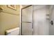 Shower with glass doors and bright white tile surround at 5649 Summerside Ln # 41B, Sarasota, FL 34231