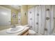 Full bathroom with vanity and shower featuring a fun, fish-themed curtain at 5649 Summerside Ln # 41B, Sarasota, FL 34231