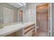 Neutral bathroom with built-in vanity and sliding door shower at 5649 Summerside Ln # 41B, Sarasota, FL 34231