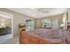Bedroom with dresser and a slider to the screened in lanai at 5649 Summerside Ln # 41B, Sarasota, FL 34231