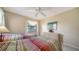 Well-lit bedroom with two beds and comfortable furnishings at 5649 Summerside Ln # 41B, Sarasota, FL 34231