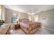 Comfortable bedroom with light wood furniture and ceiling fan at 5649 Summerside Ln # 41B, Sarasota, FL 34231