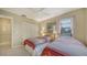 Bright bedroom featuring twin beds, closet, and a ceiling fan at 5649 Summerside Ln # 41B, Sarasota, FL 34231