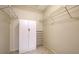 Walk-in closet featuring built-in shelving and ample storage space at 5649 Summerside Ln # 41B, Sarasota, FL 34231