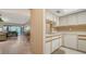 Open-concept kitchen offering an eat-in dining space, views of the living room and screened patio at 5649 Summerside Ln # 41B, Sarasota, FL 34231