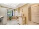 Eat-in kitchen with bright window, white cabinets and tile flooring at 5649 Summerside Ln # 41B, Sarasota, FL 34231