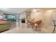Spacious living room and dining area with access to lanai at 5649 Summerside Ln # 41B, Sarasota, FL 34231