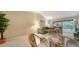 Living and dining area features tile floors and access to the screened in lanai at 5649 Summerside Ln # 41B, Sarasota, FL 34231