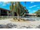 Relaxing pool area with chaise lounges, palm trees and pavers at 5649 Summerside Ln # 41B, Sarasota, FL 34231