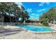 Inviting community pool surrounded by lush landscaping and lounge chairs at 5649 Summerside Ln # 41B, Sarasota, FL 34231