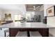 Bright kitchen with large island, stainless appliances, light cabinetry and seating for entertaining at 5751 Wilena Pl, Sarasota, FL 34238