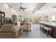 Open floor plan features tile flooring, with a large living area leading to the dining area and kitchen at 5751 Wilena Pl, Sarasota, FL 34238