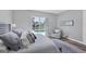 This bedroom features a comfortable king bed and overlooks a pool area at 5881 Girona Pl, Sarasota, FL 34238