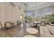 Spacious clubhouse features stylish chairs, tables, and expansive windows overlooking lush greenery at 5881 Girona Pl, Sarasota, FL 34238