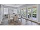 Bright dining room featuring multiple french doors leading to the outdoor patio area at 5881 Girona Pl, Sarasota, FL 34238