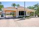 Elegant gatehouse with classic architecture, providing security and a grand entrance to the community at 5881 Girona Pl, Sarasota, FL 34238