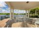 Inside the gazebo, view of the lake with comfortable seating at 5881 Girona Pl, Sarasota, FL 34238