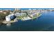 Waterfront condo building with marina, swimming pool, and beautiful landscaping at 600 Sutton Pl # B305, Longboat Key, FL 34228