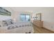 Bright bedroom with a slider door leading to a water view at 600 Sutton Pl # B305, Longboat Key, FL 34228