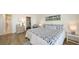 Bedroom boasts a walk-in closet and en-suite bathroom at 600 Sutton Pl # B305, Longboat Key, FL 34228
