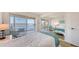 Bedroom featuring a mirrored closet and balcony overlooking the river at 600 Sutton Pl # B305, Longboat Key, FL 34228