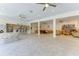 Spacious community center with kitchen, seating areas, bookshelves, and ample lighting at 600 Sutton Pl # B305, Longboat Key, FL 34228