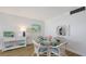 Bright dining area featuring a glass top table with seating for four at 600 Sutton Pl # B305, Longboat Key, FL 34228