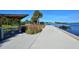 Scenic walkway with a covered picnic area and dock access along the waterfront at 600 Sutton Pl # B305, Longboat Key, FL 34228
