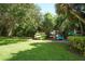 Kayak storage area surrounded by lush landscaping and beautiful trees at 600 Sutton Pl # B305, Longboat Key, FL 34228