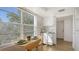 Compact kitchen area featuring ample natural light from a window and neutral tones at 600 Sutton Pl # B305, Longboat Key, FL 34228