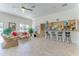 Spacious recreation room with full kitchen, bar, comfortable seating, and abundant natural light at 600 Sutton Pl # B305, Longboat Key, FL 34228