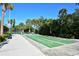 Community shuffleboard courts surrounded by lush landscaping and recreational facilities at 600 Sutton Pl # B305, Longboat Key, FL 34228