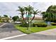 Sutton Place street sign marks the entrance to this lushly landscaped Gulf of Mexico community at 600 Sutton Pl # B305, Longboat Key, FL 34228