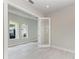 Bright room with natural light and open glass doors to other parts of the house at 6028 Cat Claw Ln, Bradenton, FL 34210