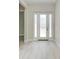 Inviting foyer with light tile flooring and a white door with sidelights, creating a bright, welcoming entrance at 6028 Cat Claw Ln, Bradenton, FL 34210