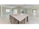 Bright living room with tile flooring, sliding glass doors, and a view of the outdoor area at 6028 Cat Claw Ln, Bradenton, FL 34210