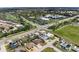 Aerial view of neighborhood and surrounding area with golf course and community pool at 609 Glen Oak Rd, Venice, FL 34293