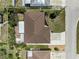 Aerial view of the property showcasing its layout, landscaping, and proximity to surrounding neighborhood at 609 Glen Oak Rd, Venice, FL 34293