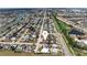 An aerial view of a residential neighborhood with a golf course and water features in the vicinity at 609 Glen Oak Rd, Venice, FL 34293