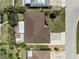 Aerial view of the property showcasing the roof, landscaping, and driveway at 609 Glen Oak Rd, Venice, FL 34293