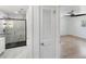 View of a remodeled bathroom and bedroom area with modern design and flooring at 609 Glen Oak Rd, Venice, FL 34293