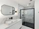 Modern bathroom showcases stylish vanity, sleek fixtures, and glass-enclosed shower at 609 Glen Oak Rd, Venice, FL 34293