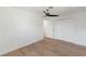 Open bedroom featuring wood flooring, a ceiling fan, and a spacious closet at 609 Glen Oak Rd, Venice, FL 34293