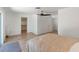 Bedroom featuring wood floors, a ceiling fan, and closet space at 609 Glen Oak Rd, Venice, FL 34293