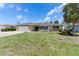 Well-maintained single-story home with an attached garage and manicured lawn at 609 Glen Oak Rd, Venice, FL 34293