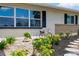 Charming home with a landscaped front yard and decorative pink bicycle at 609 Glen Oak Rd, Venice, FL 34293