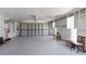 Spacious garage features ample storage with built-in shelving and room for multiple vehicles at 609 Glen Oak Rd, Venice, FL 34293